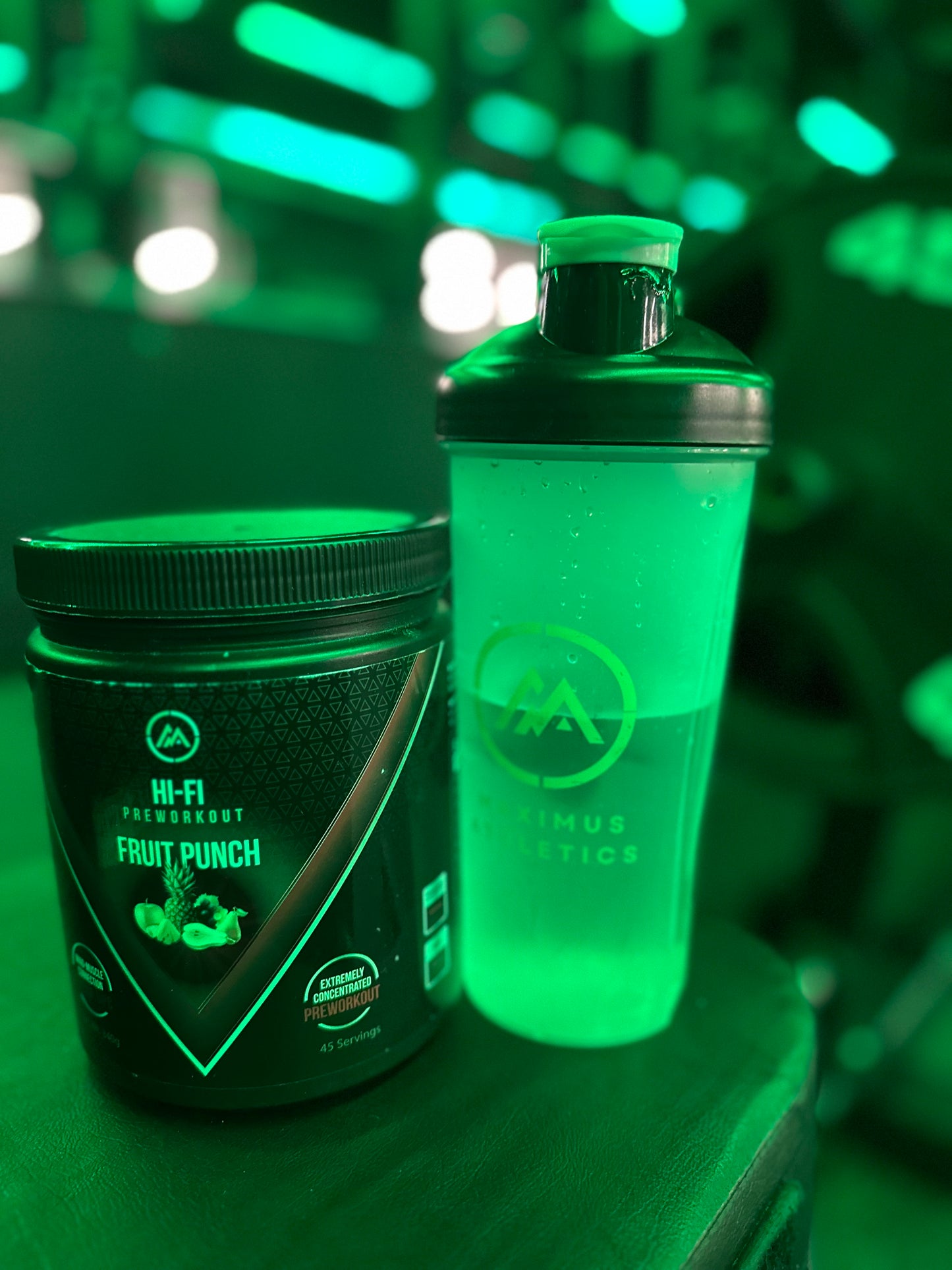 Maximus Athletics Pre Workout and Shaker under green lighting